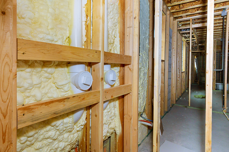 Wall of a basement thermal hydro insulation with spray foam at house construction