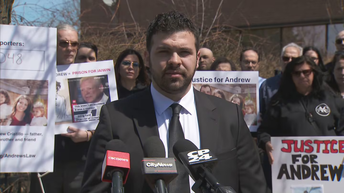 Jordan Cristillo speaking at a courthouse in Newmarket